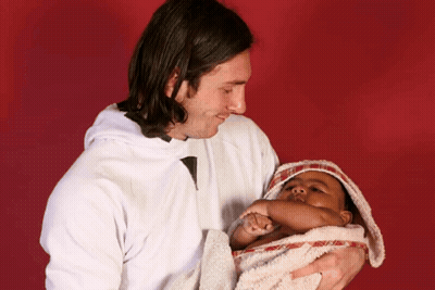 Man Holding Baby Wrapped In Towel GIF
