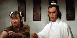 Man Holding Back His Companion GIF