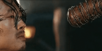 Man Holding Barbed Wire Bat In Mouth GIF
