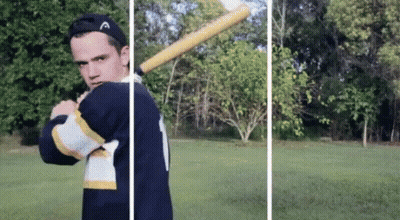 Man Holding Baseball Bat In Field GIF
