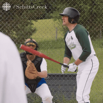 Man Holding Baseball Bat In Front Of Fence #Schitts Creek GIF