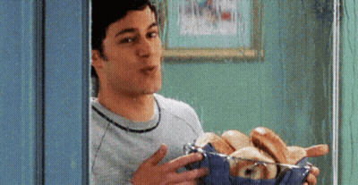 Man Holding Basket Of Hot Dogs And Bread GIF