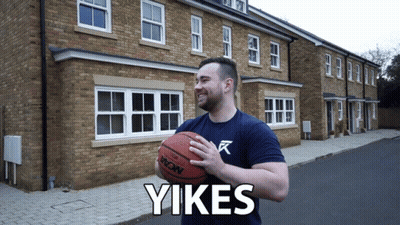Man Holding Basketball In Front Of Brick Building Saying Yikes GIF