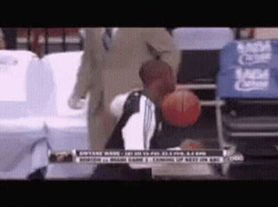 Man Holding Basketball In Front Of MGM Logo GIF