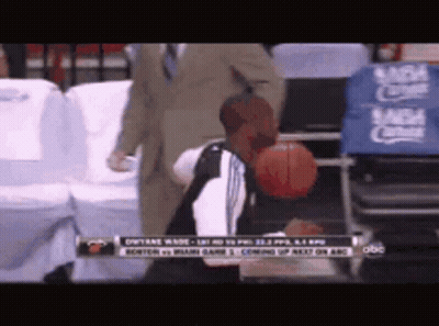 Man Holding Basketball In Front Of NBA Sign GIF