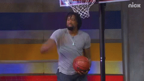 Man Holding Basketball In Front Of Nick Hoop GIF