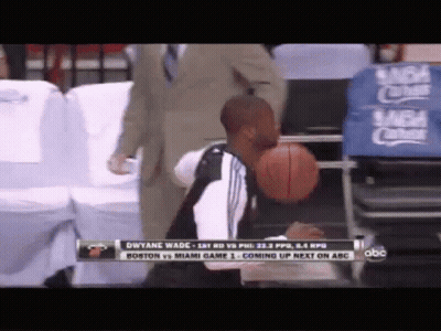 Man Holding Basketball In Mouth Watching Boston Vs Miami GIF