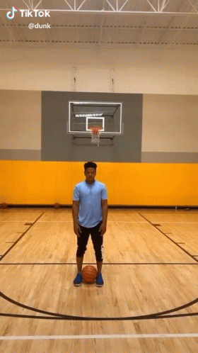 Man Holding Basketball On Court GIF