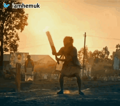 Man Holding Bat In Front Of Iamhemuk Sign GIF