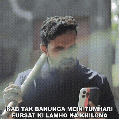 Man Holding Bat Looking At Phone Kab Tak Banunga Mein Tumhari GIF