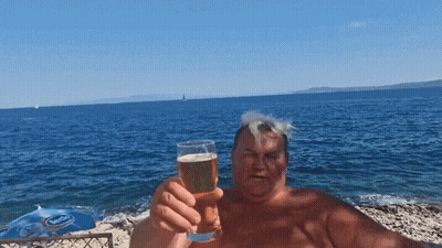 Man Holding Beer Glass By Pepsi Umbrella GIF