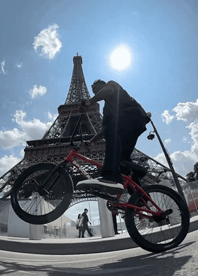 Man Holding Bike Over Head In Bike Race GIF