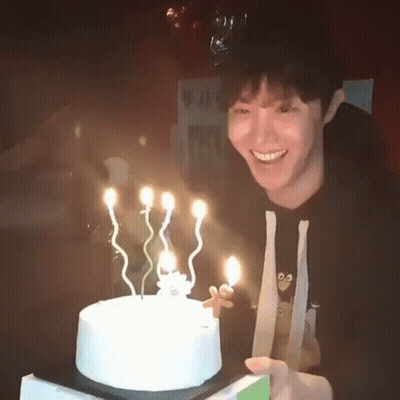Man Holding Birthday Cake Smiling GIF