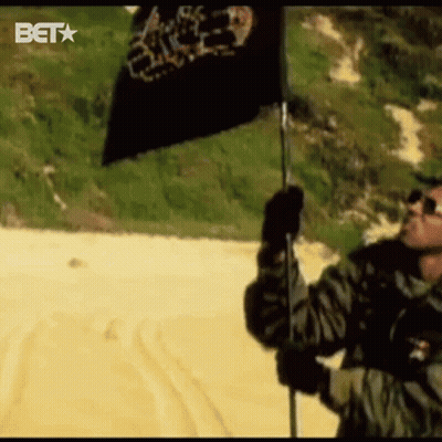 Man Holding Black Flag With BET Logo GIF