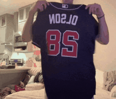 Man Holding Black Jersey Number 85 GIF