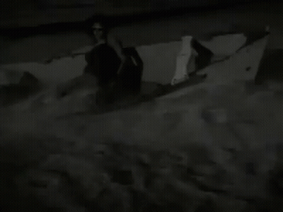 Man Holding Blue Balloon In Front Of Speeds & Scooters Sign GIF