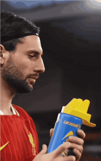Man Holding Blue Bottle Of Gatorade GIF