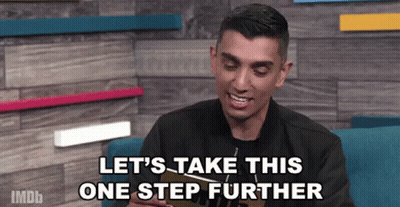 Man Holding Book Saying Let's Take This One Step Further GIF