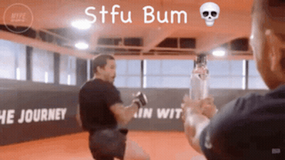Man Holding Bottle In Gym Saying STFU Bum GIF