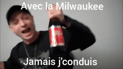 Man Holding Bottle Of Milwaukee Juice GIF