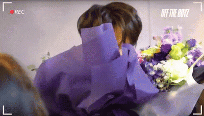Man Holding Bouquet Of Flowers GIF