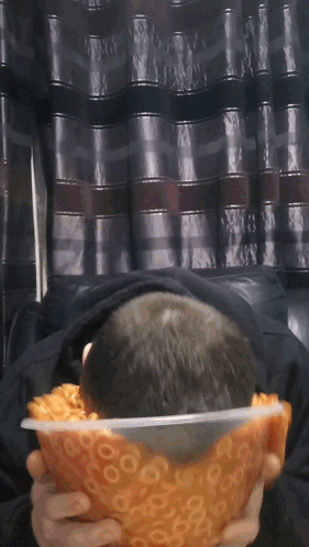 Man Holding Bowl Of Macaroni And Cheese Rings GIF
