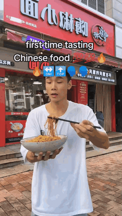 Man Holding Bowl Of Noodles At Chinese Food Store GIF