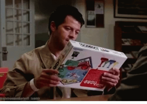 Man Holding Box Of Game Called Cowboy GIF