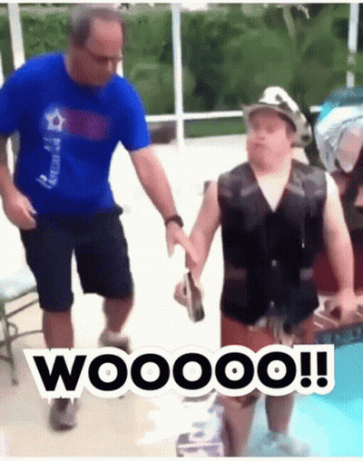 Man Holding Boy In Swimming Pool With Life Vest And Hat GIF