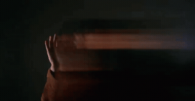 Man Holding Burning Log In Office GIF