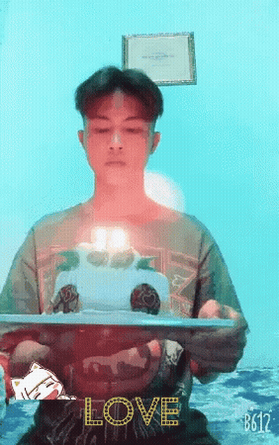 Man Holding Cake Saying Love GIF