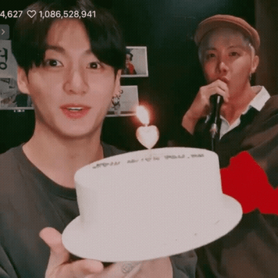 Man Holding Cake With Heart Candle GIF