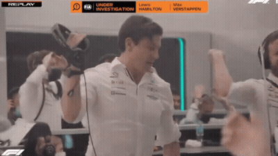 Man Holding Camera In Front Of Replay Screen GIF