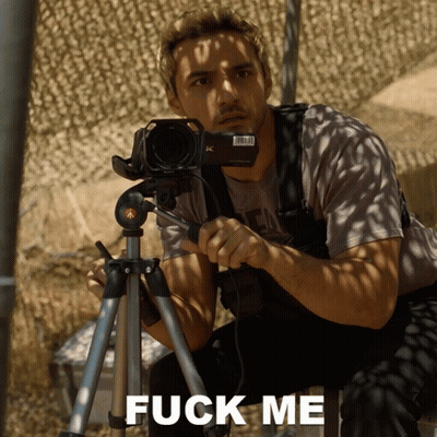 Man Holding Camera On Tripod Saying Fuck Me GIF