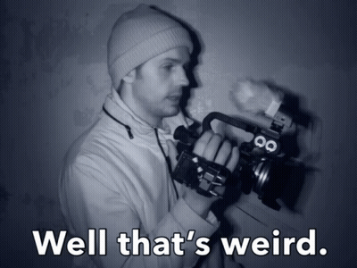 Man Holding Camera Saying Well That's Weird GIF