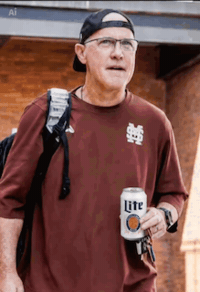 Man Holding Can of Lite Beer