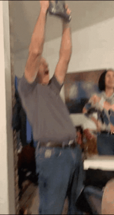 Man Holding Can Over Head GIF