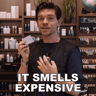 Man Holding Card And Perfume It Smells Expensive GIF