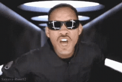 Man Holding Card Saying MIB GIF