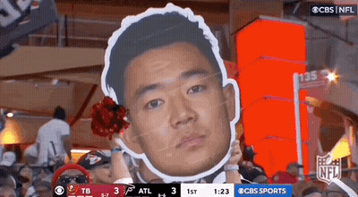 Man Holding Cardboard Face Cutout GIF