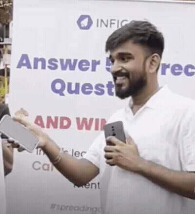 Man Holding Cell Phone In Front Of Answer Quest Sign GIF