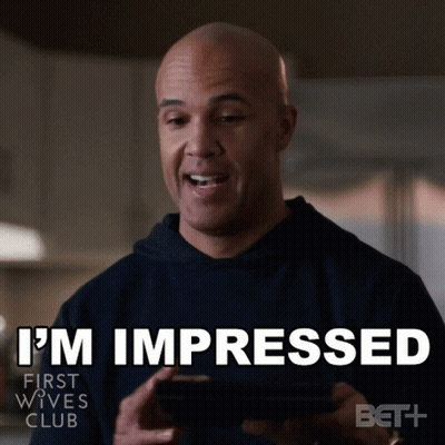 Man Holding Cell Phone Saying I'm Impressed GIF
