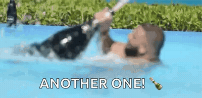 Man Holding Champagne Bottle In Pool GIF