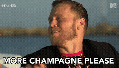 Man Holding Champagne Bottle Saying More Champagne Please GIF