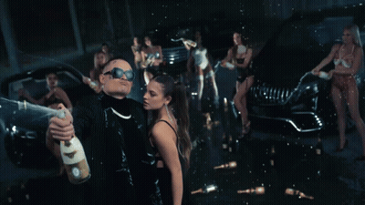 Man Holding Champagne In Front Of Woman GIF