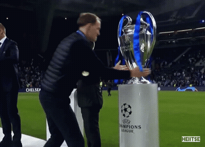 Man Holding Champions League Trophy GIF