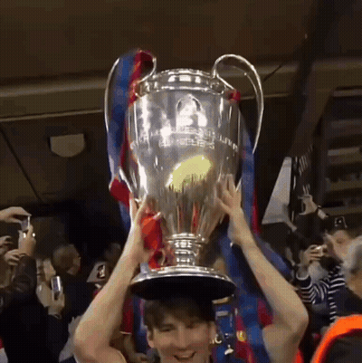 Man Holding Champions League Trophy GIF
