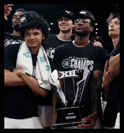 Man Holding Champions Trophy GIF