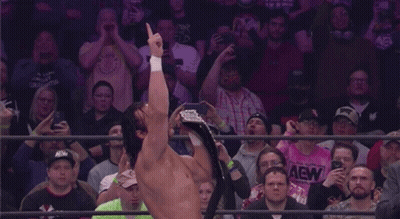 Man Holding Championship Belt GIF