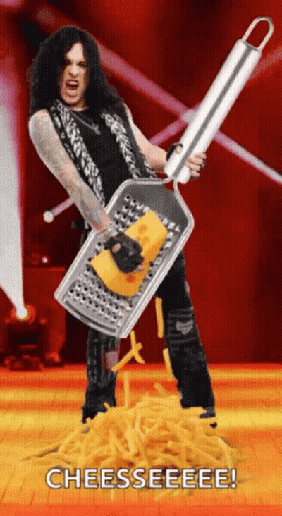 Man Holding Cheese Grater Over Pile Of Cheese GIF